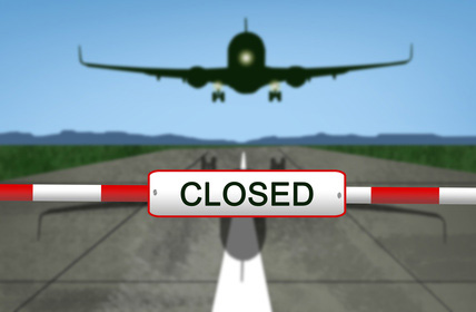 plane_landing_with_closed_sign